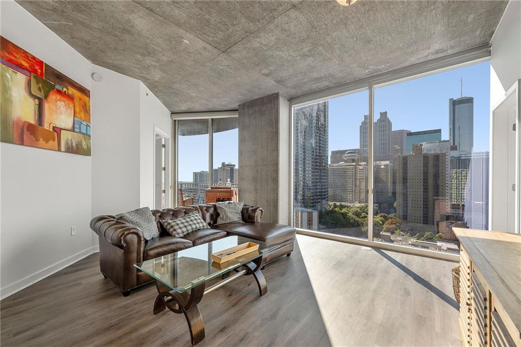 a living room with furniture and a large window