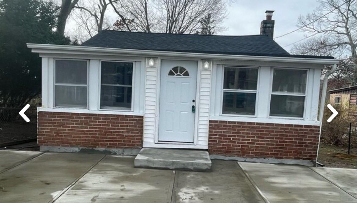 View of front of property with a patio