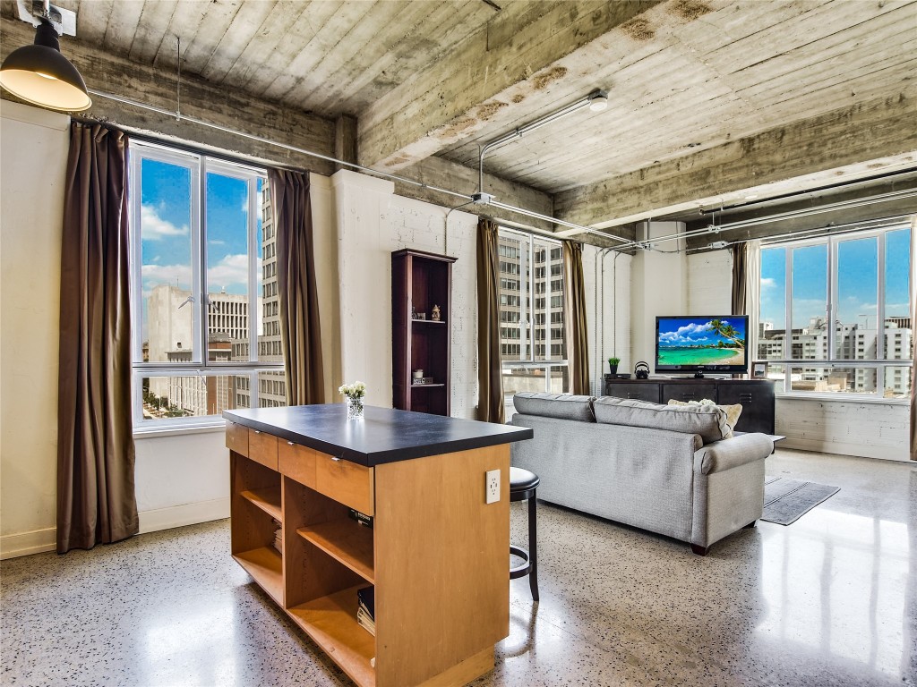 a living room with furniture and a large window