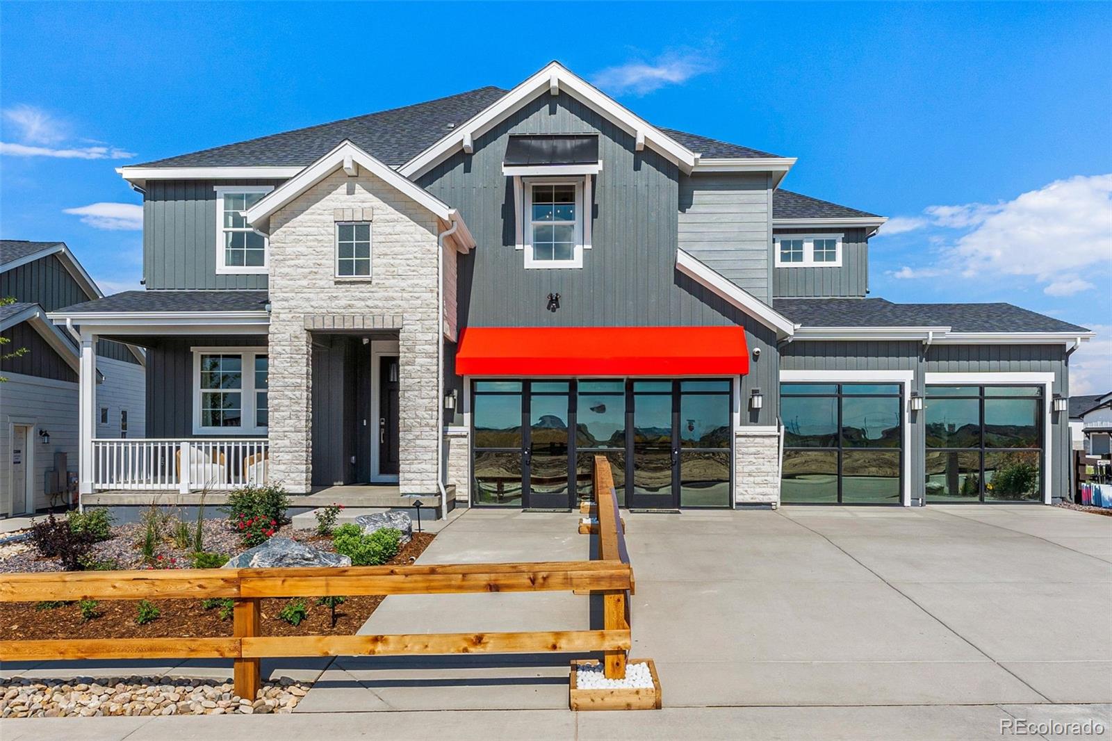 a front view of house with yard and outdoor seating