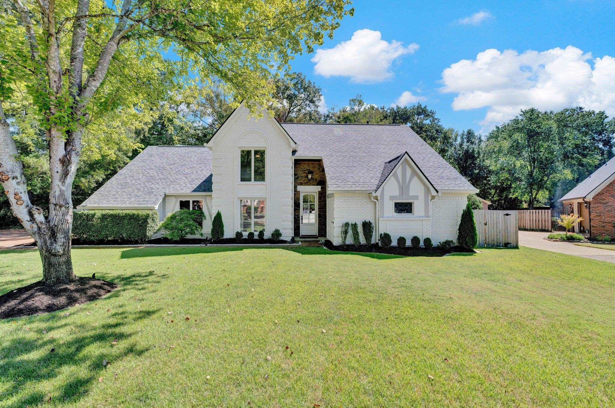 View of front of property with a front lawn