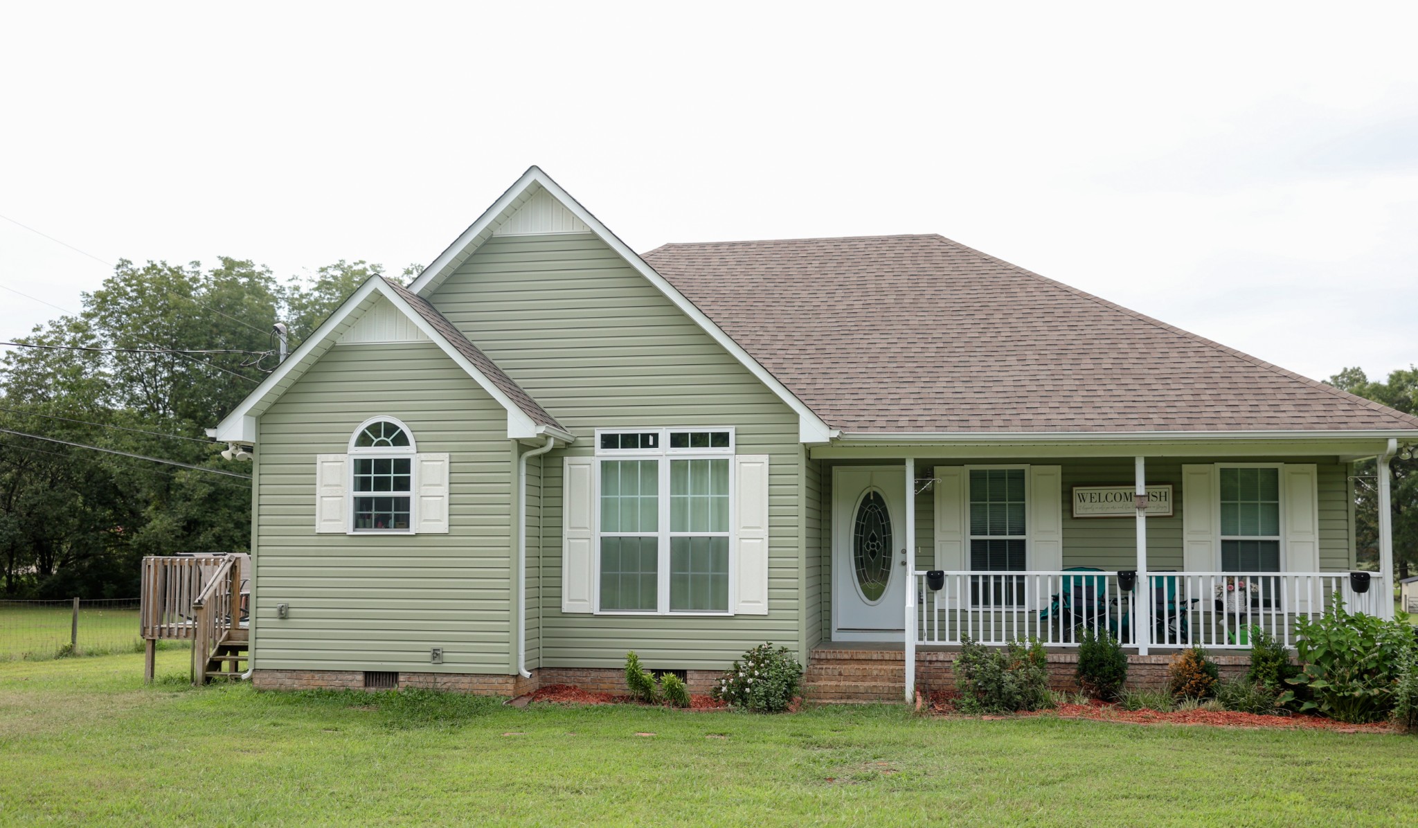 a front view of a house with a yard