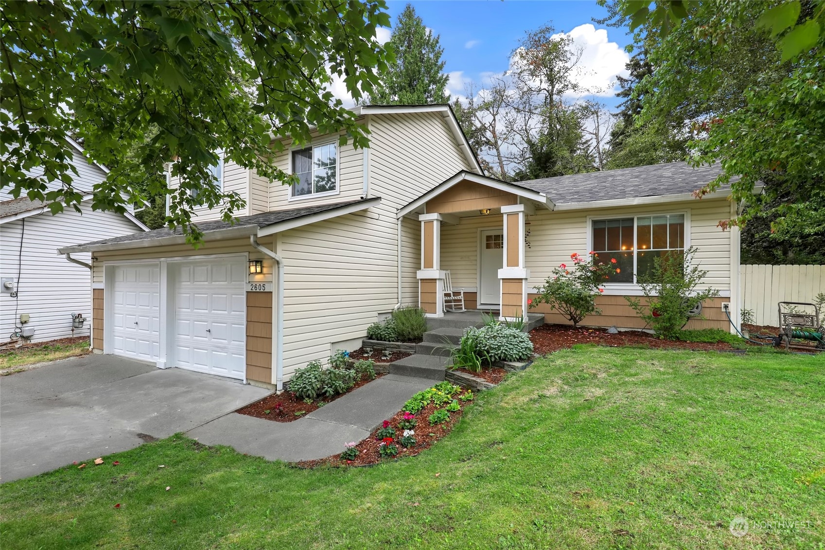 a front view of house with yard and green space