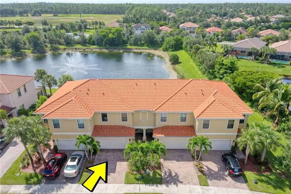 an aerial view of a house with a lake view