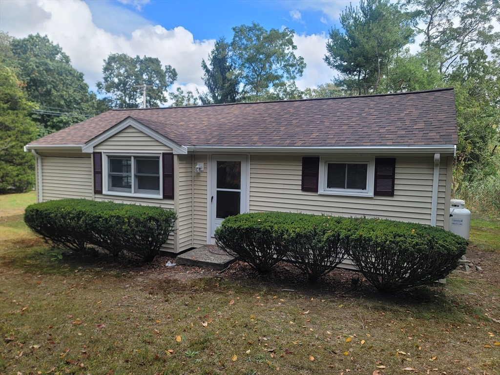 a front view of a house with a yard