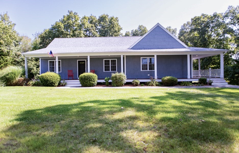 a front view of a house with garden