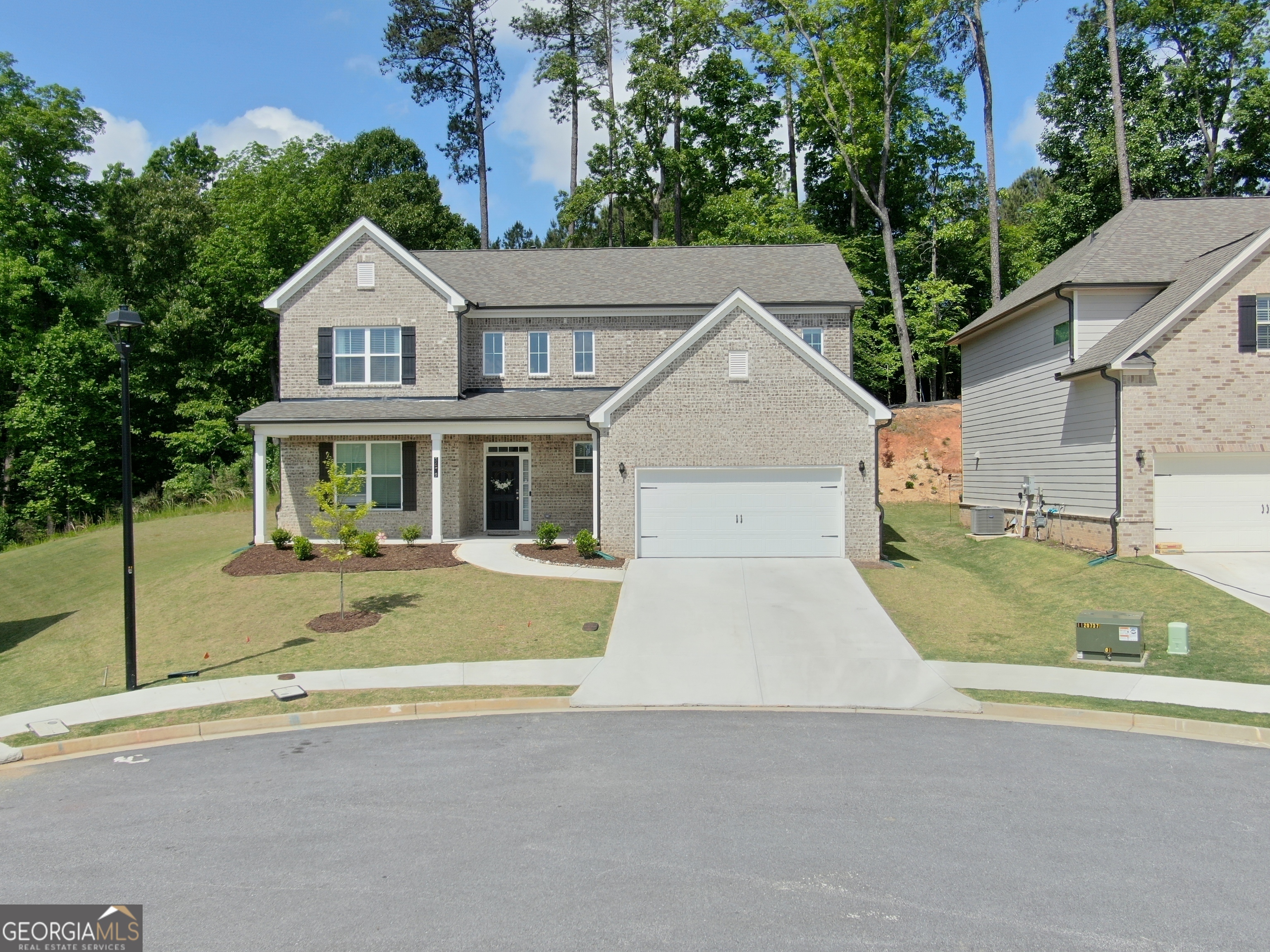 a view of house that has a street