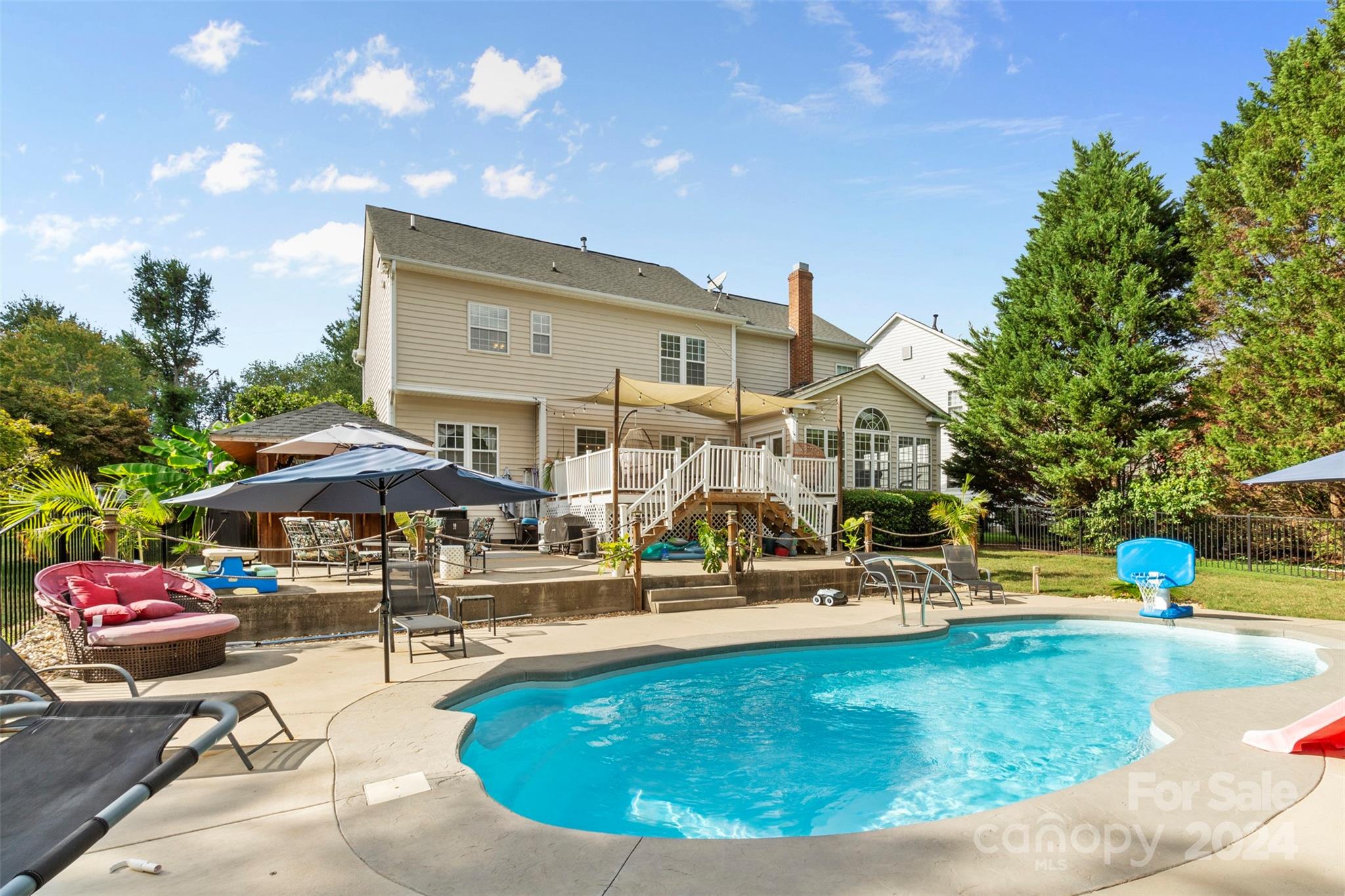 a view of a swimming pool with outdoor seating