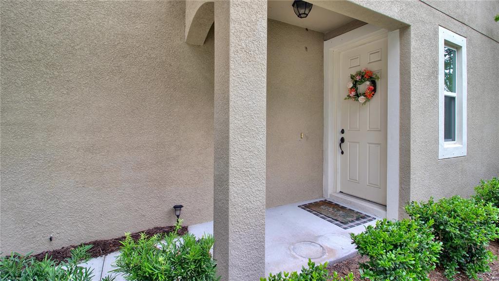 a view of a front door and wooden floor