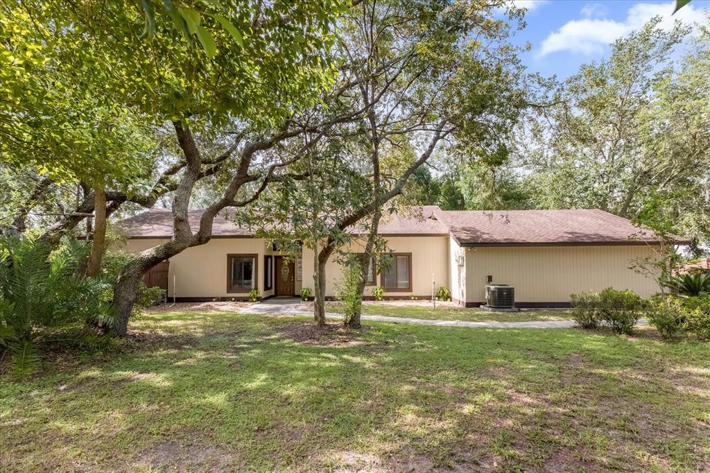 a house with trees in the background