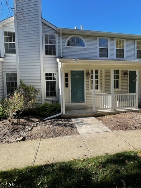 a front view of a house with yard