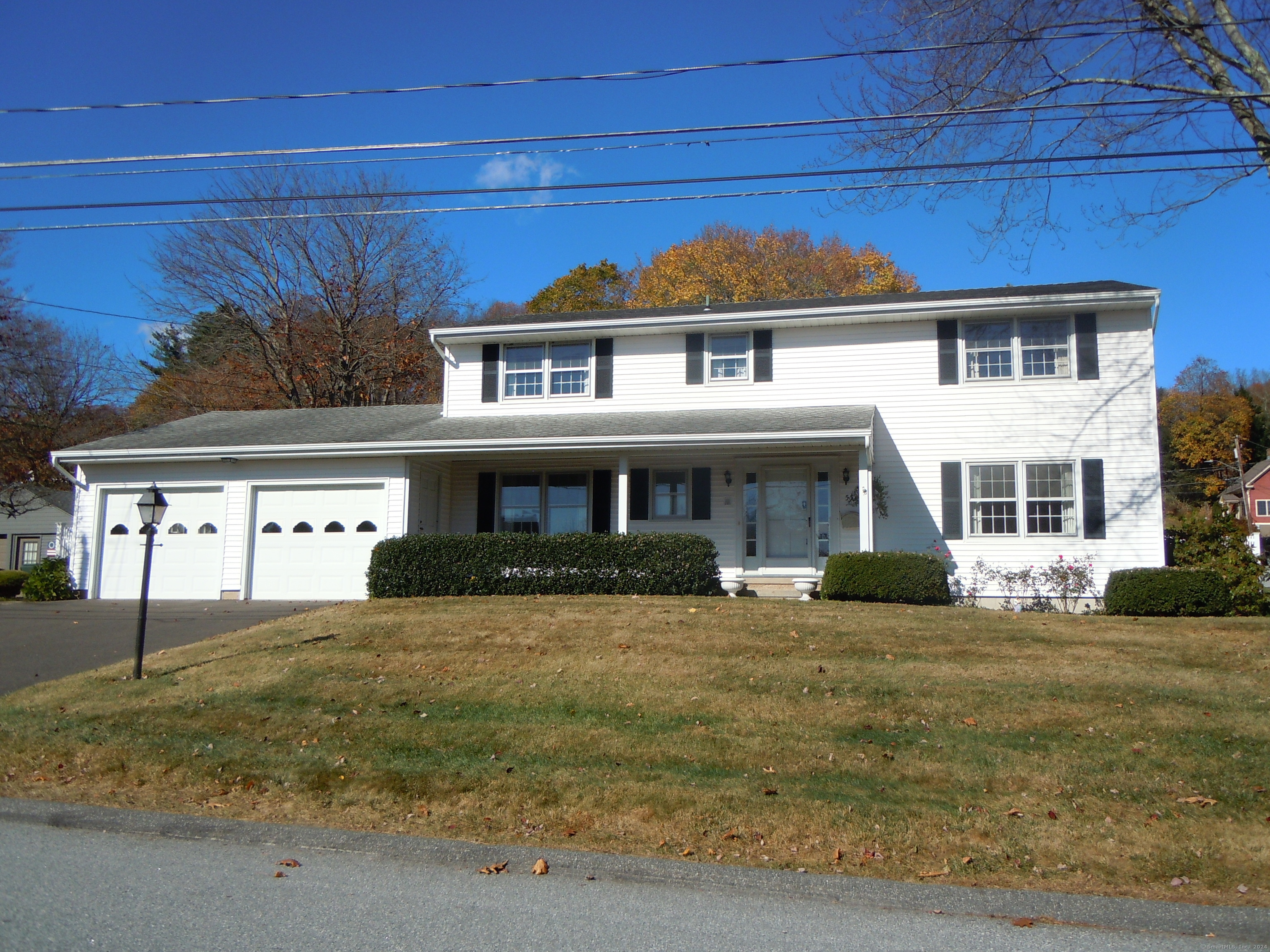 a view of a big house with a yard