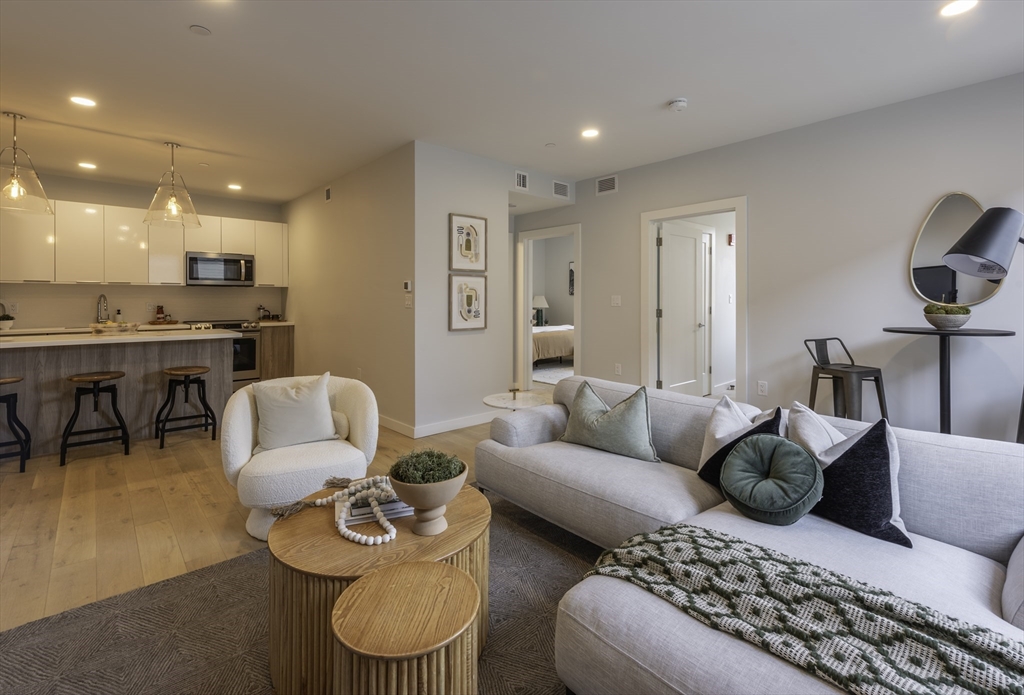 a living room with furniture and a table