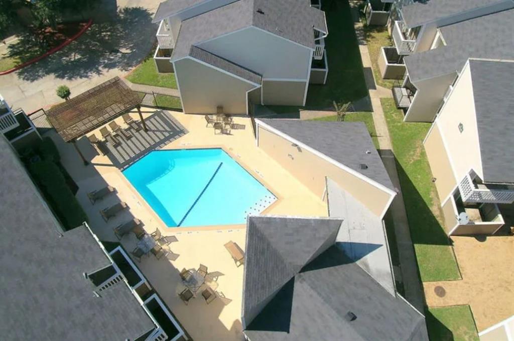 an aerial view of a house with outdoor space