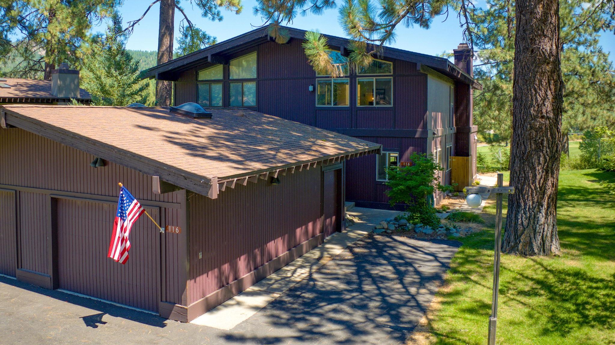 a view of house with backyard