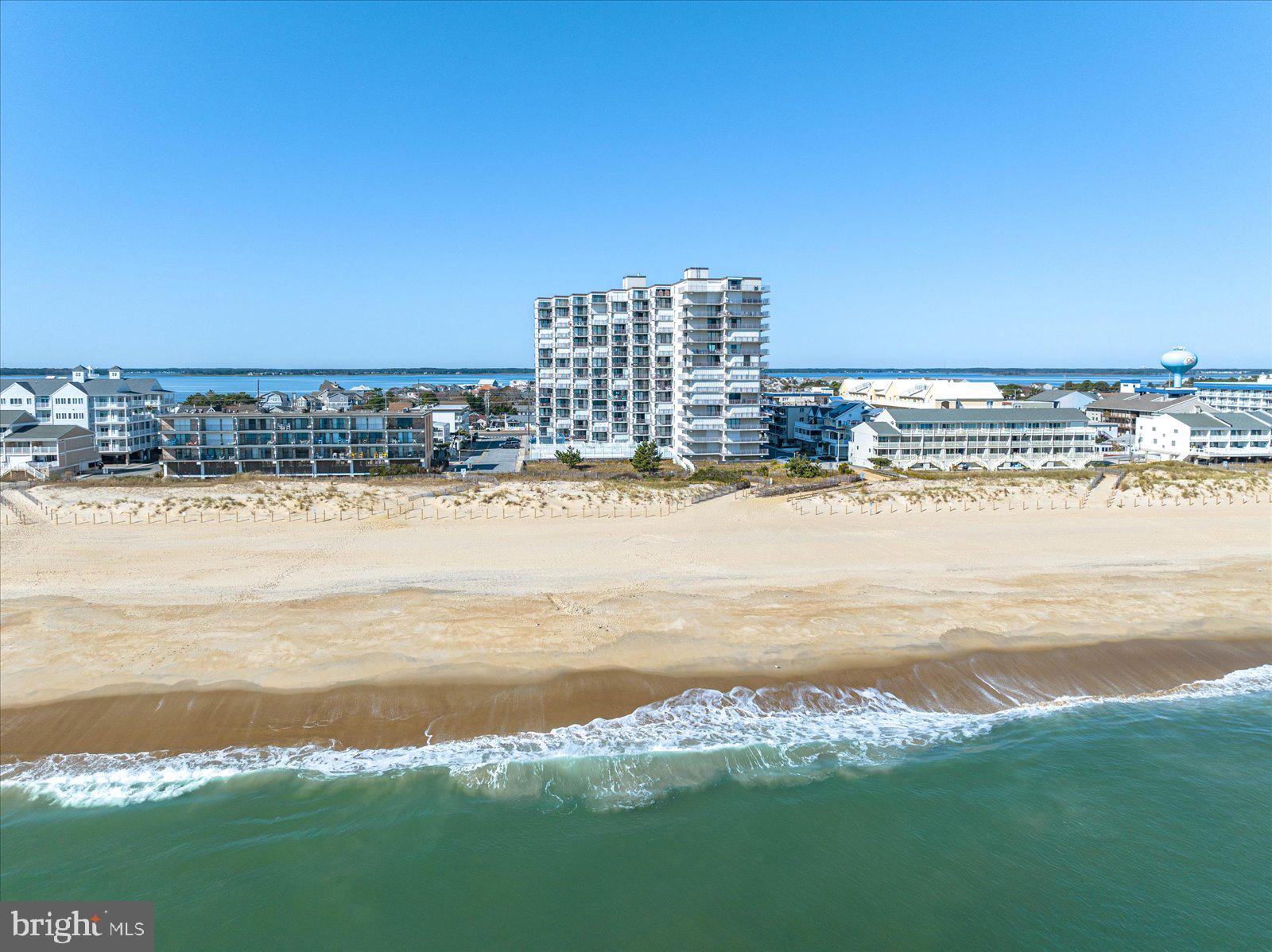 a view of a ocean with tall buildings