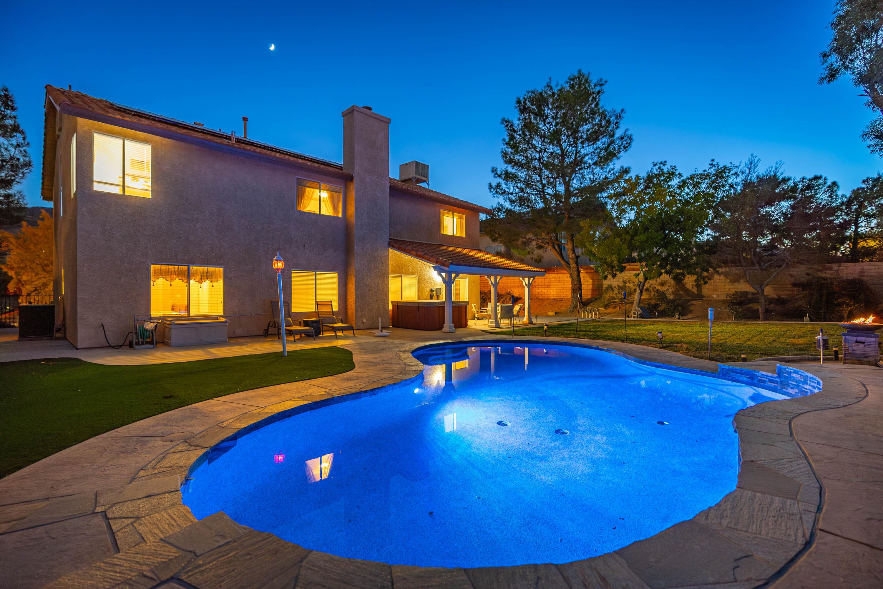 a view of a swimming pool with an outdoor space and seating area