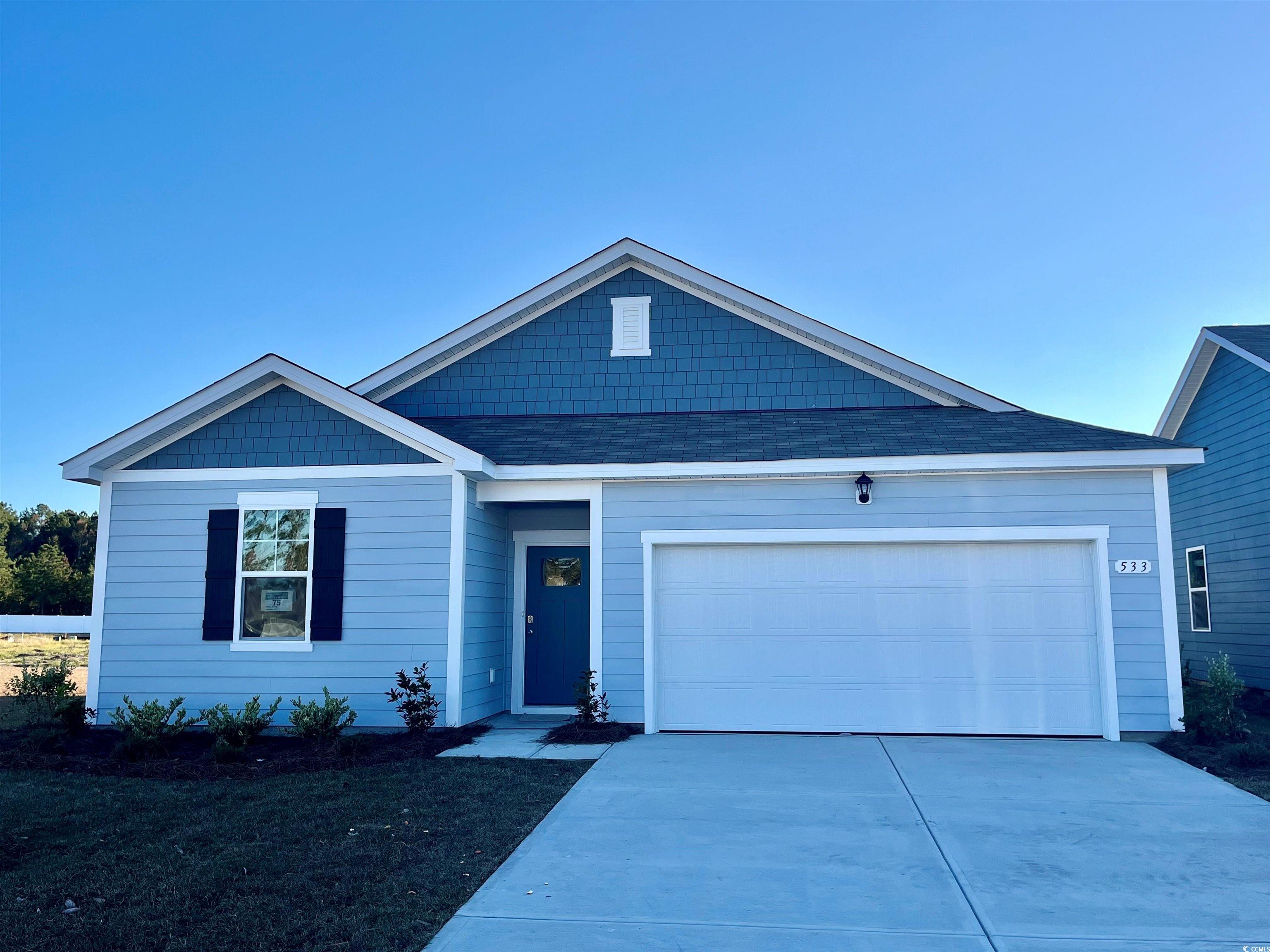 View of front of home featuring a garage