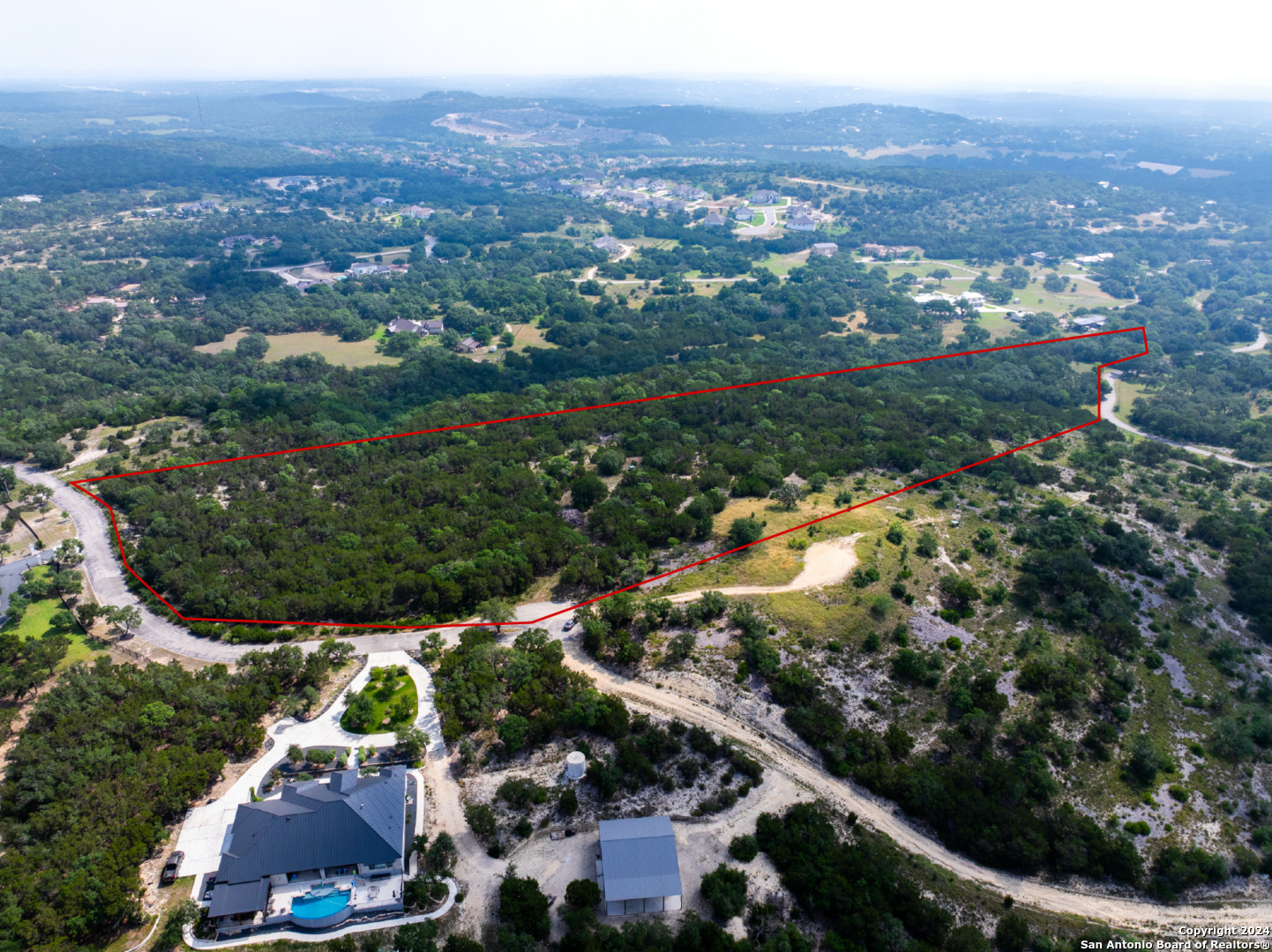 an aerial view of residential houses and outdoor space