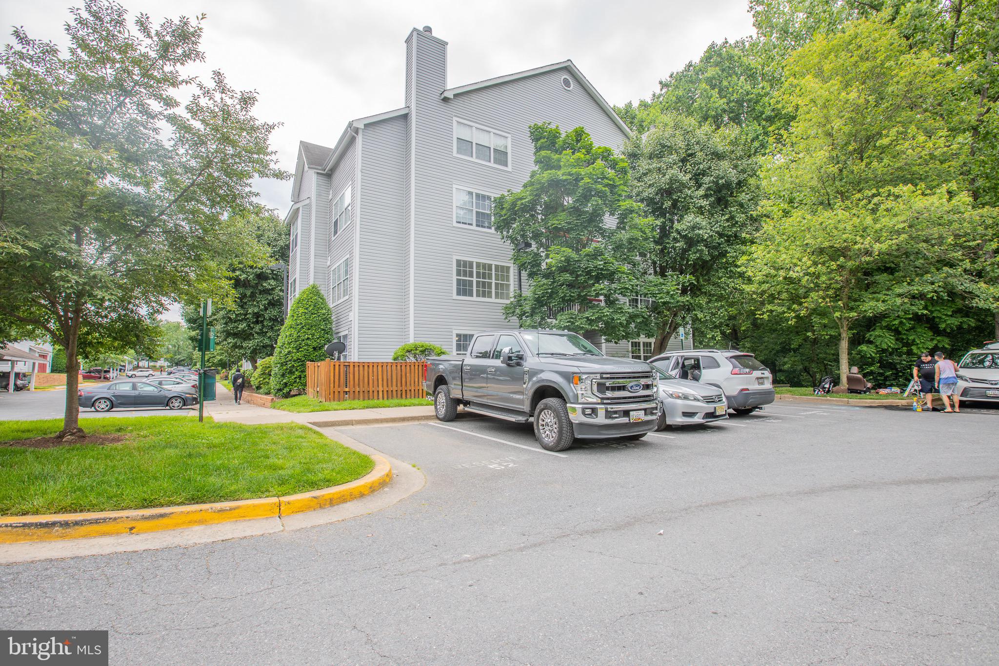 a view of cars parked in front of a house