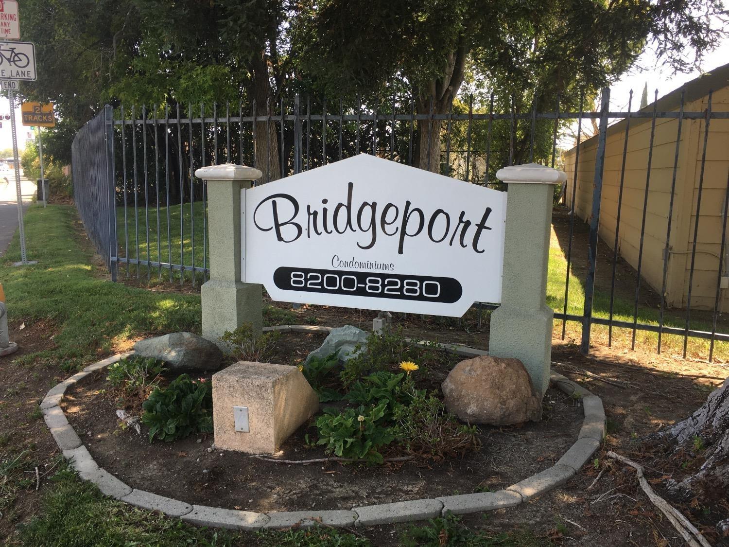 a view of outdoor space with signage and flags