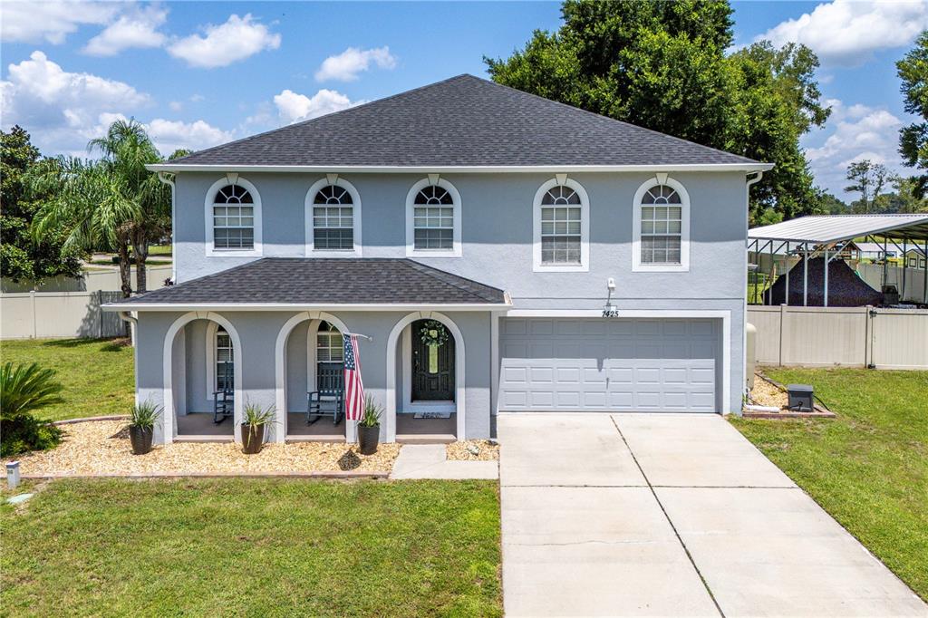 a front view of a house with a yard