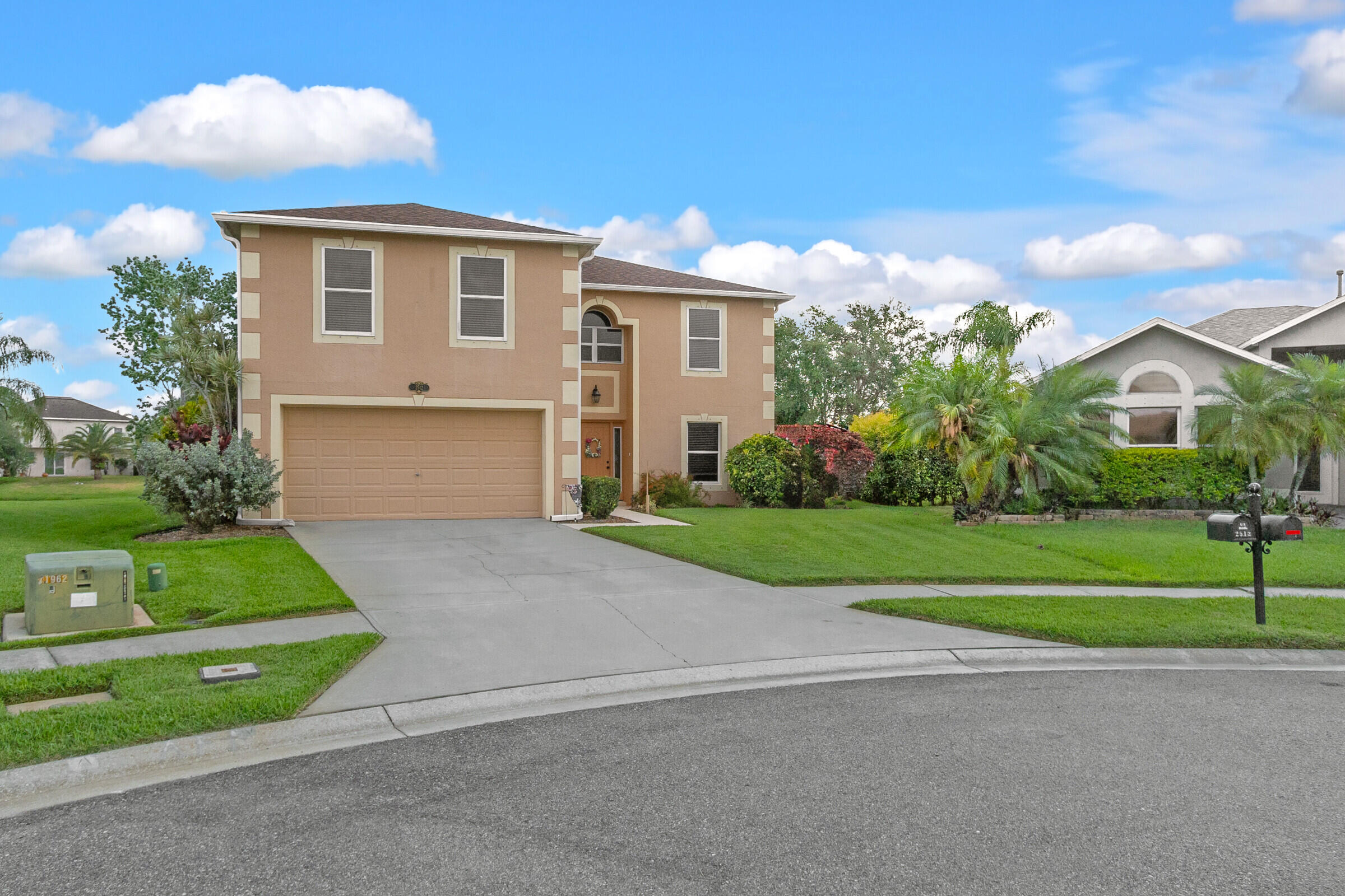 a front view of house with yard and green space