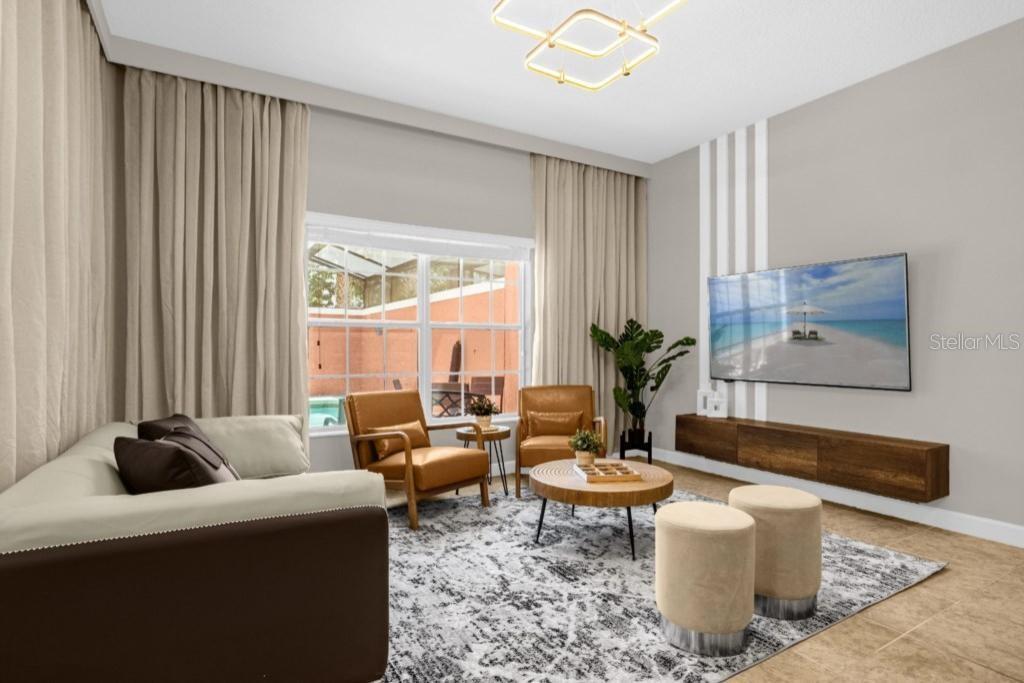 a living room with furniture a table and a potted plant