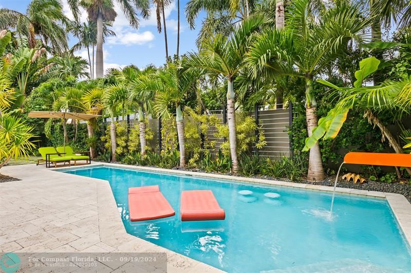 swimming pool with an outdoor space and seating area