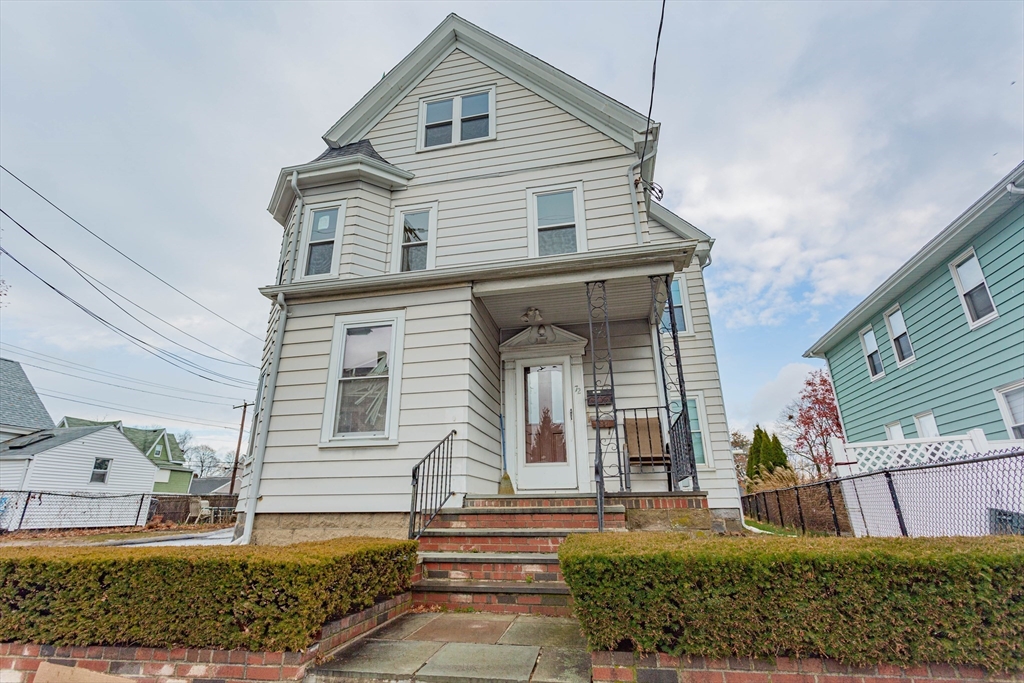 a front view of a house with a yard