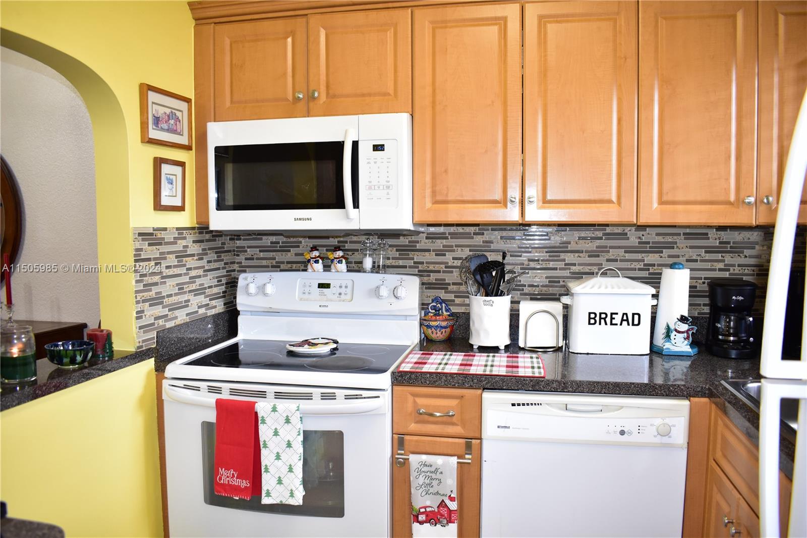 a kitchen with a stove and a microwave