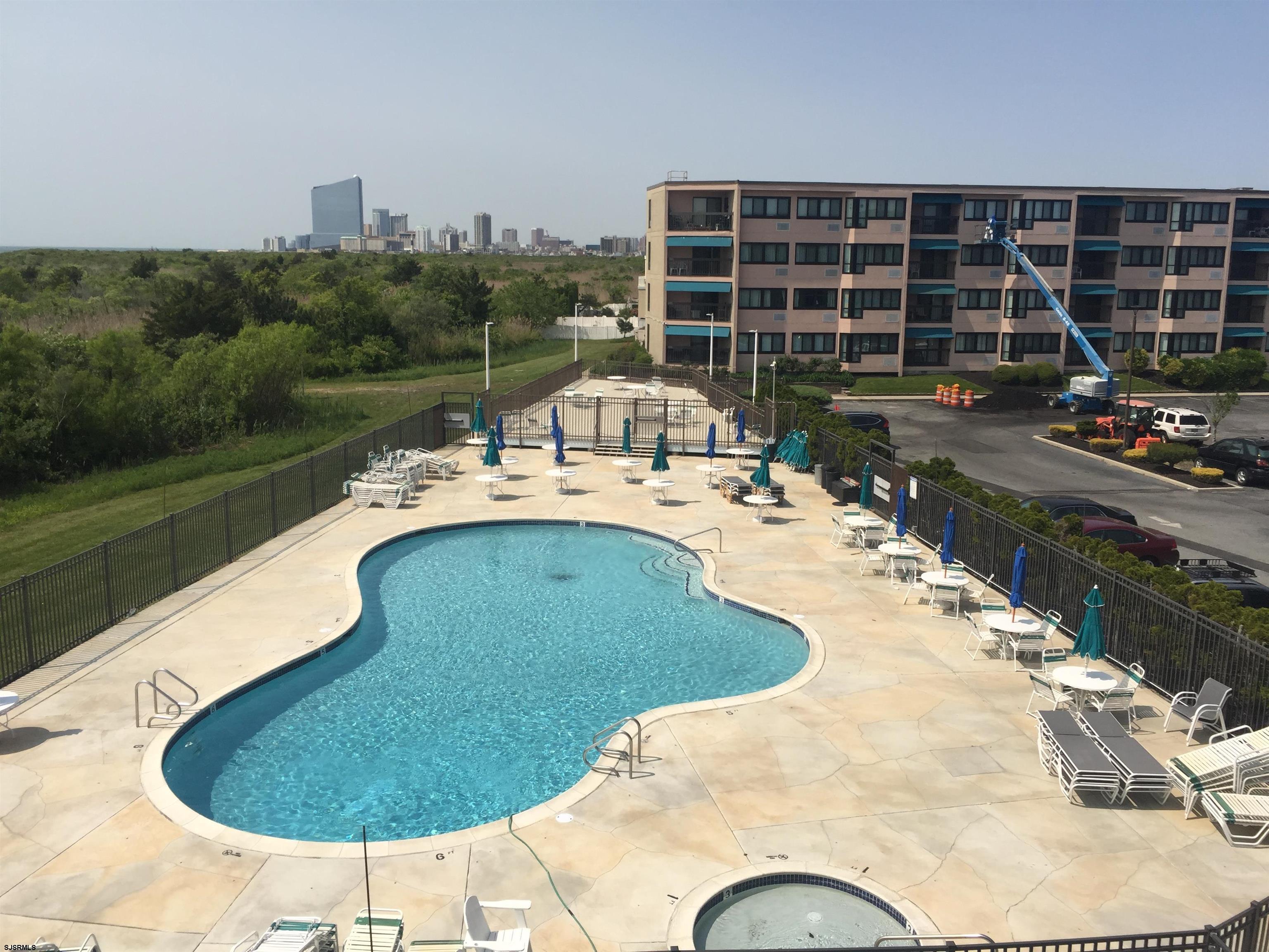 a view of a swimming pool with a patio