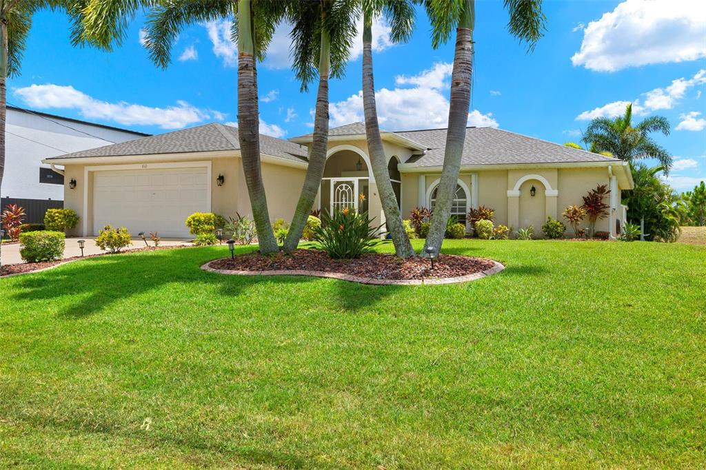 a front view of a house with garden