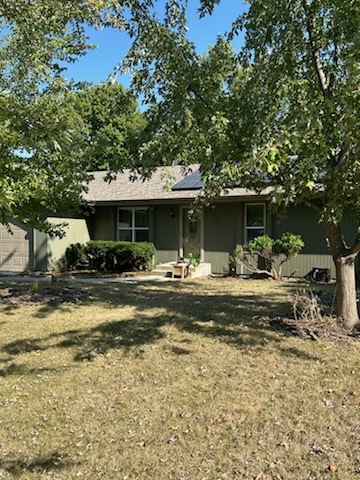 a view of a house with swimming pool and sitting area