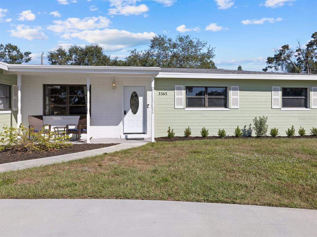 a front view of house with yard having seating