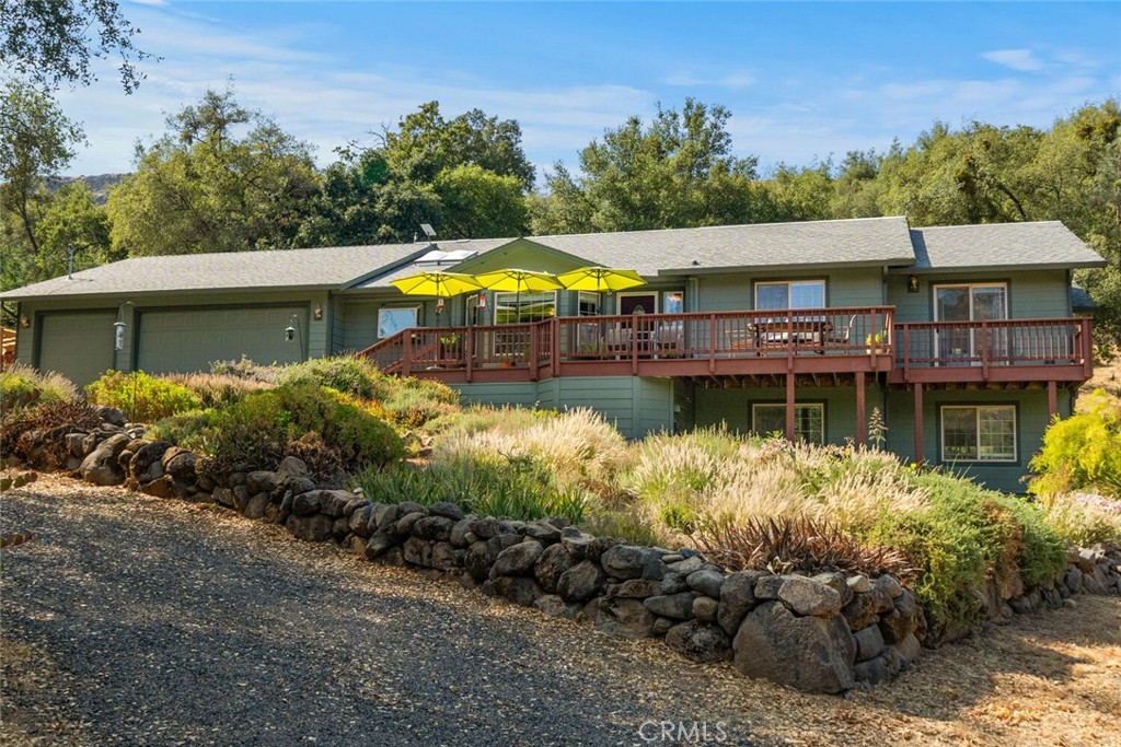 an aerial view of a house with a yard basket ball court and outdoor seating