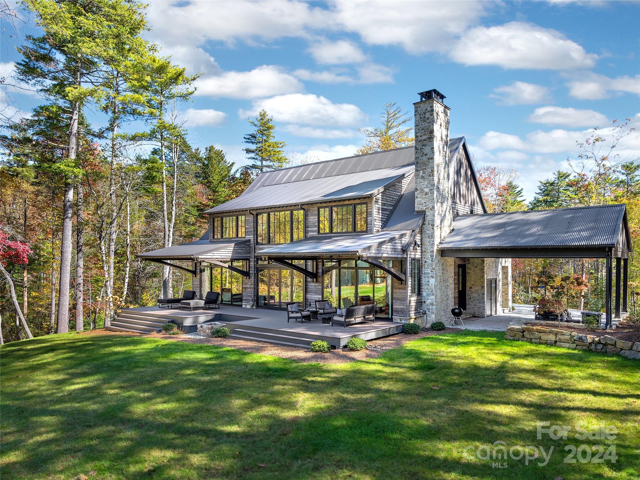 a house view with swimming pool and garden space