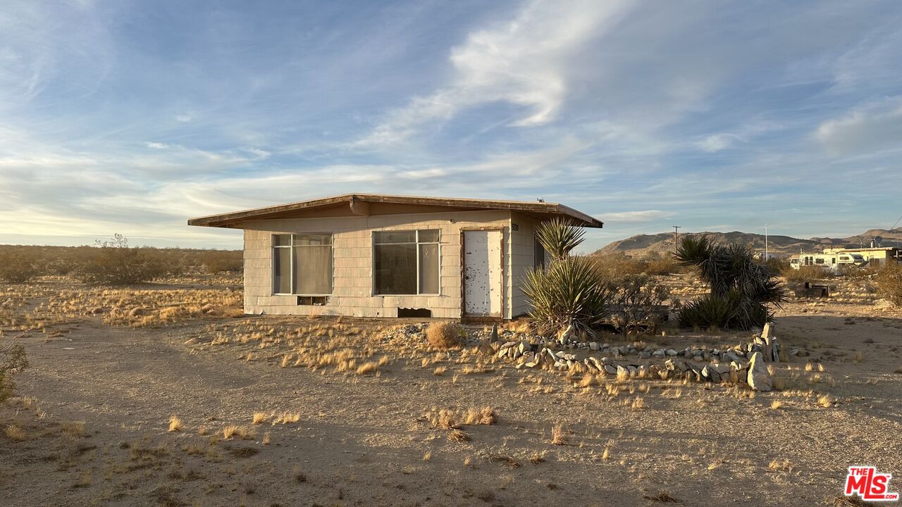 a view of house with outdoor space