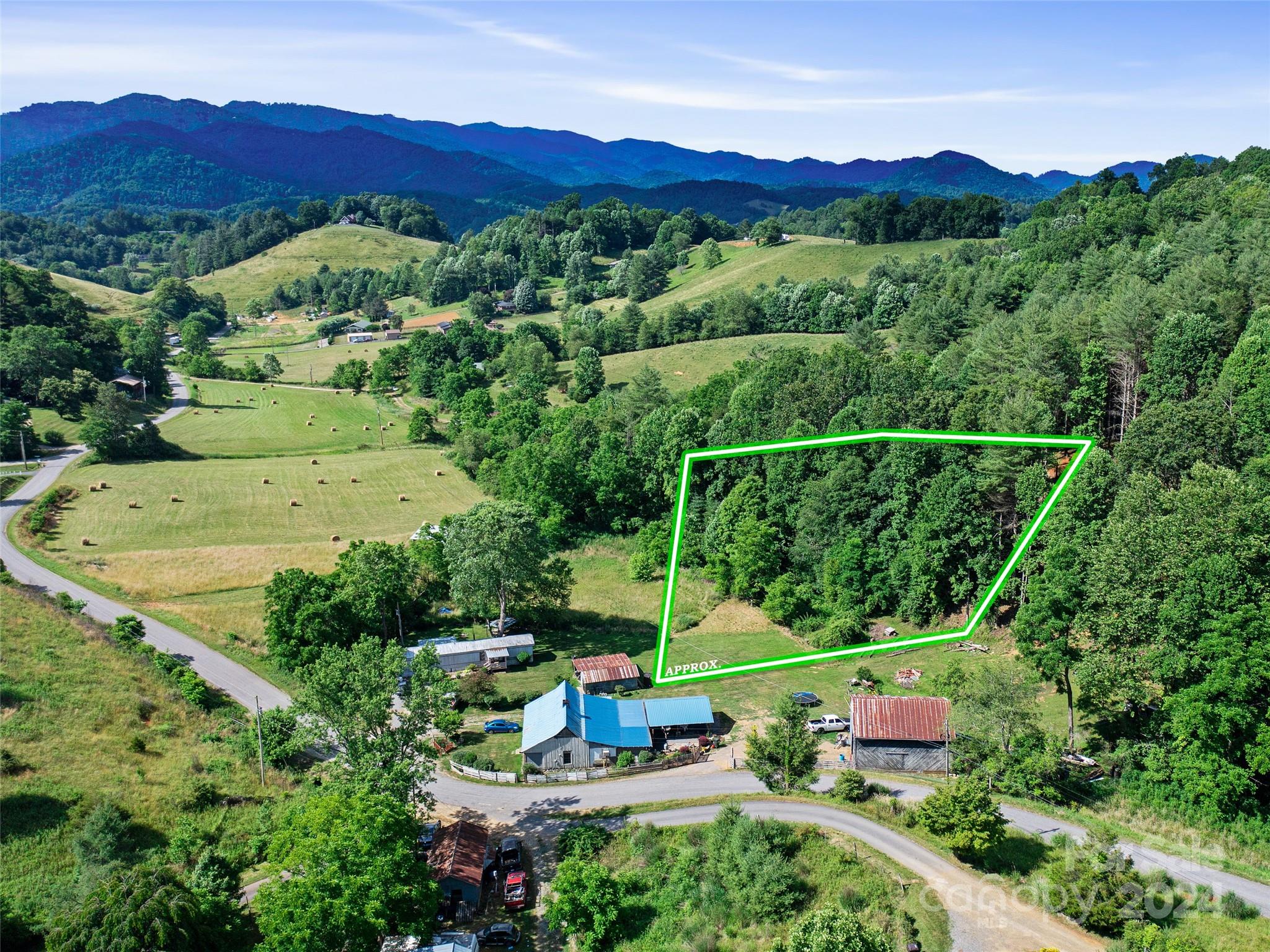 an aerial view of a house with a mountain view