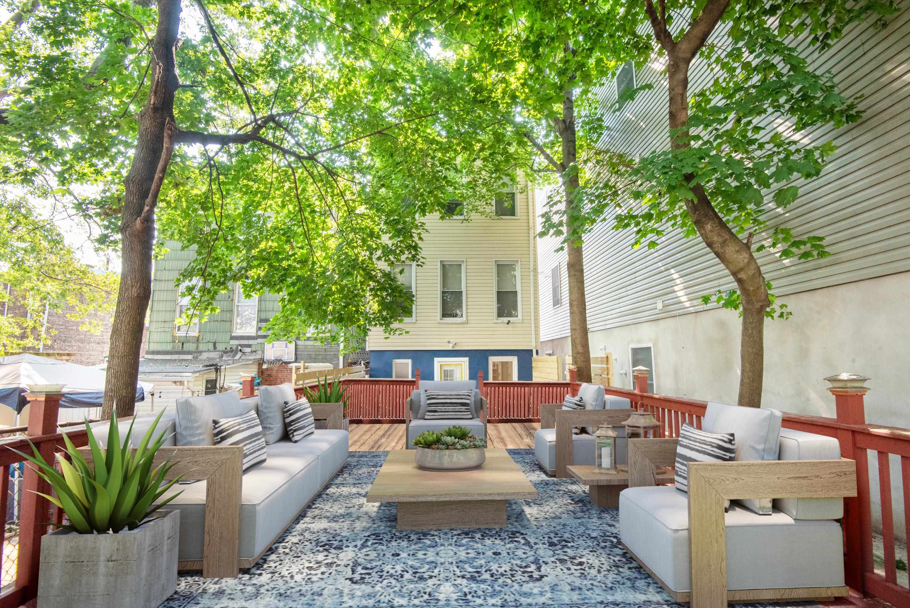 a outdoor space with patio the couches and a dining table with chairs