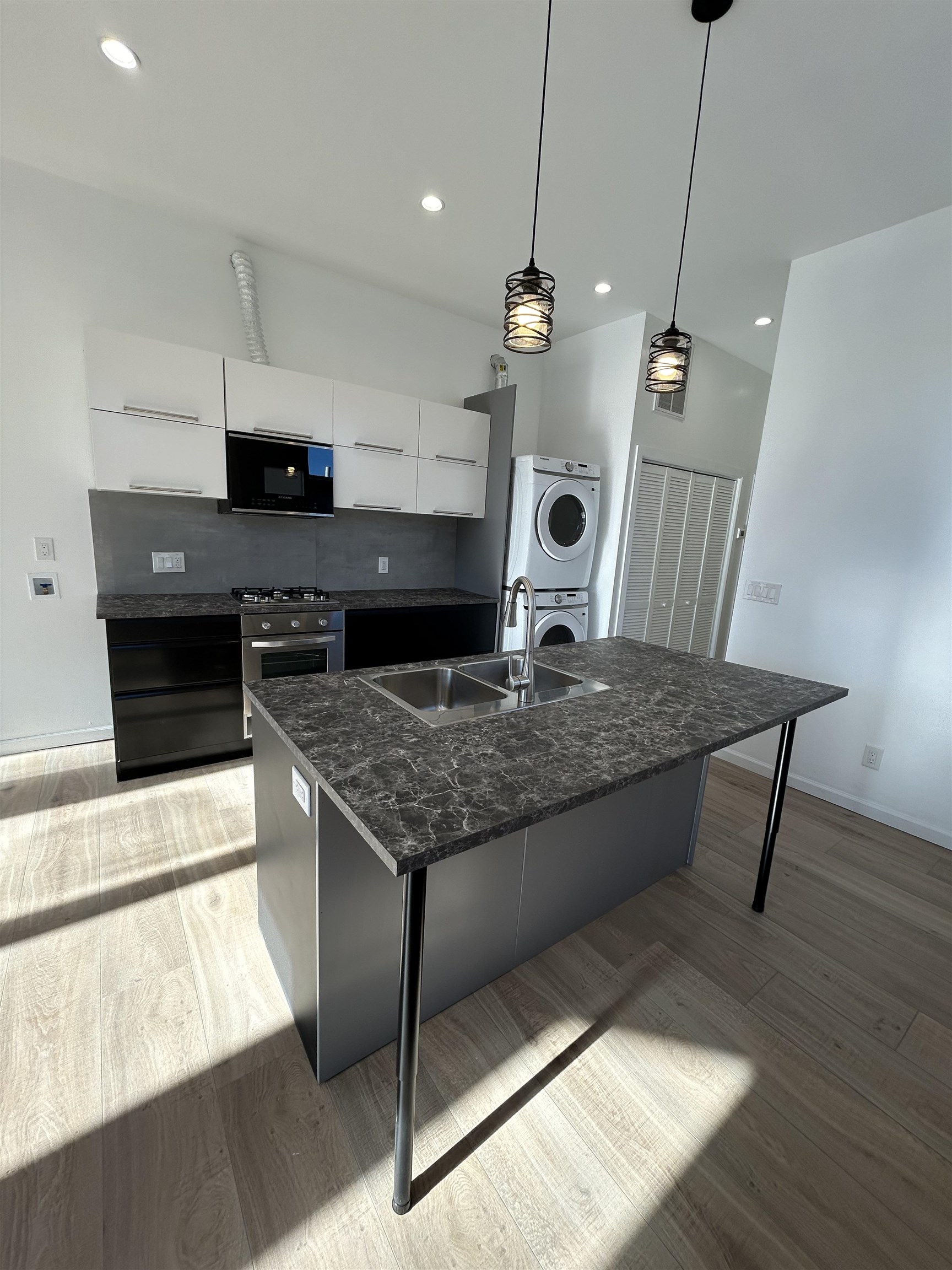 a kitchen with a table and chairs in it