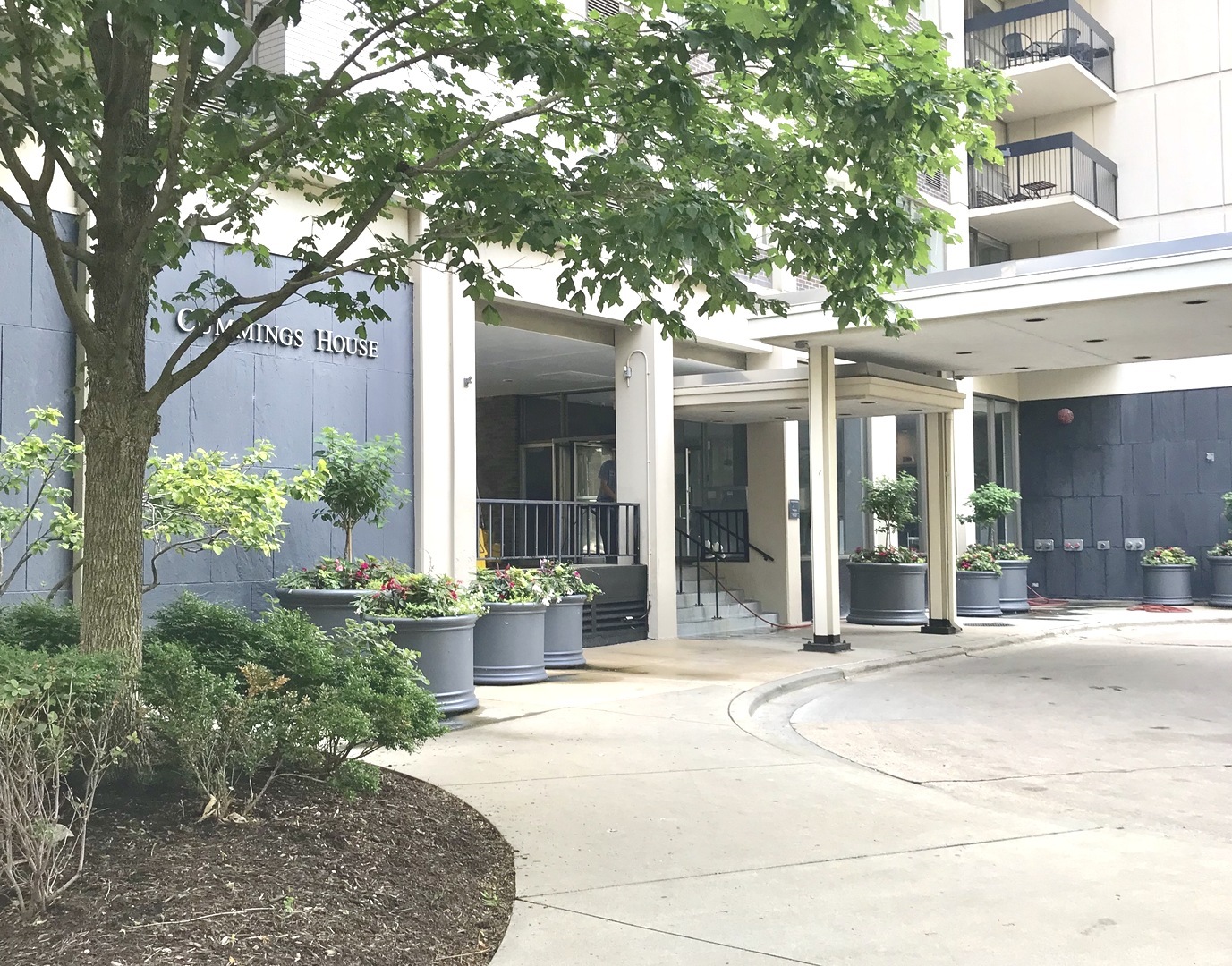 a view of a building with a tree