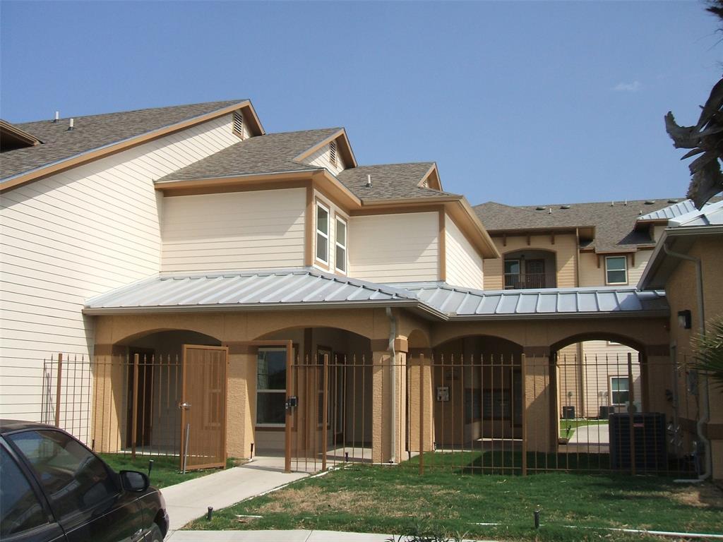 front view of a house with a garden