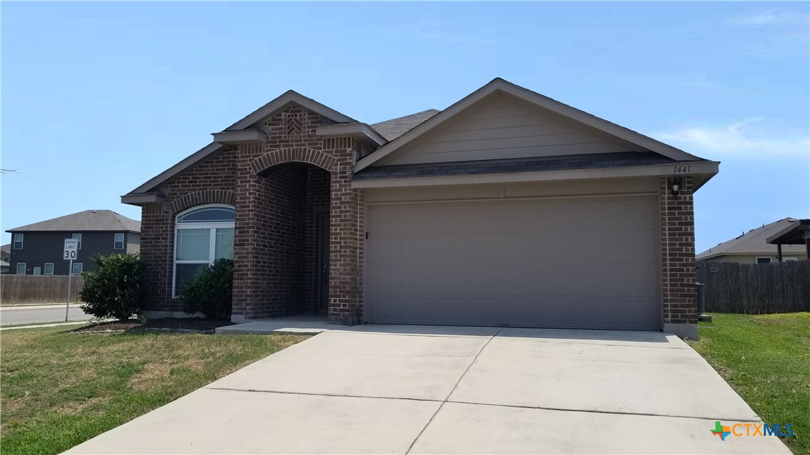 a front view of a house with yard