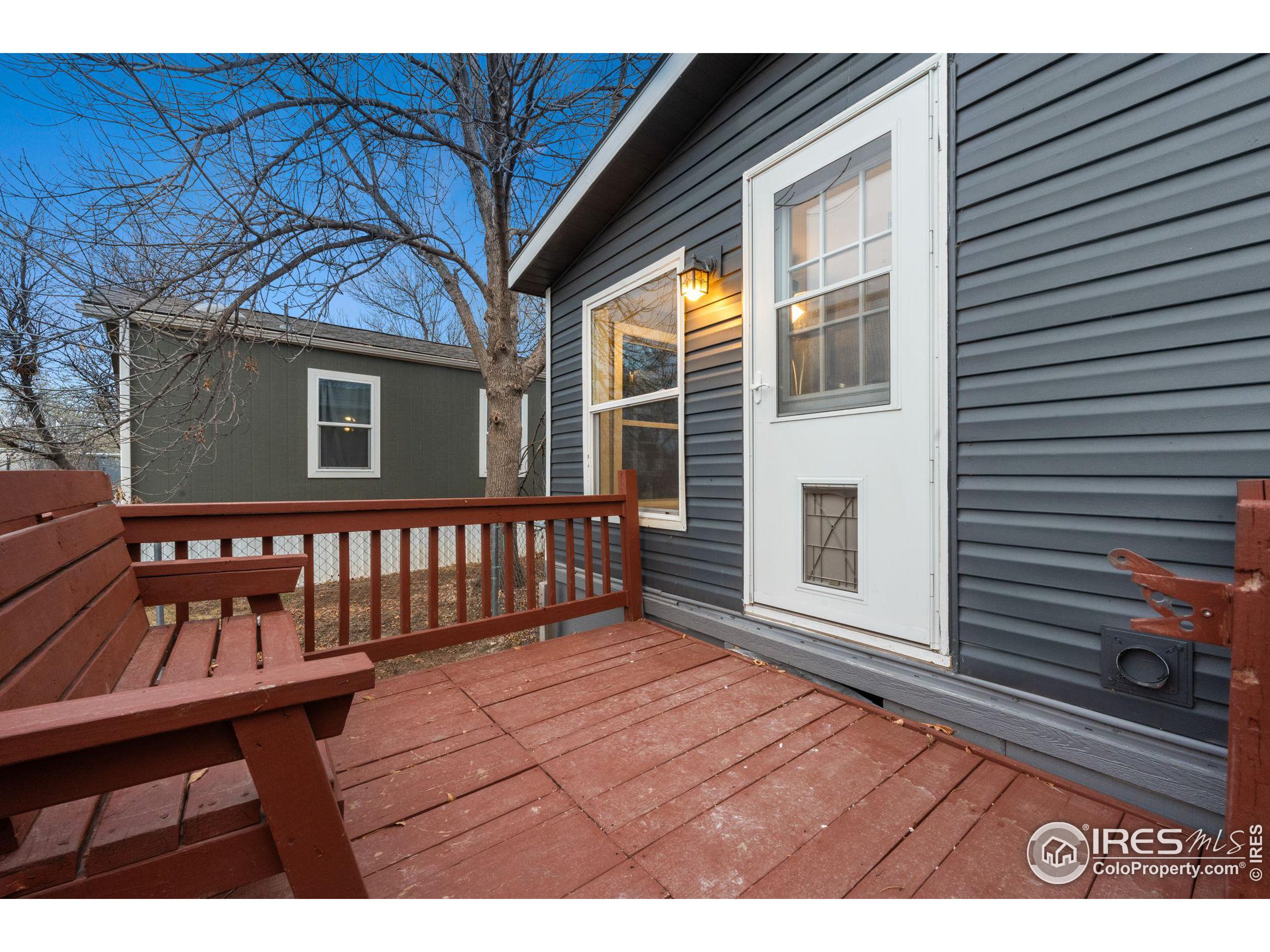 a view of a house with wooden deck