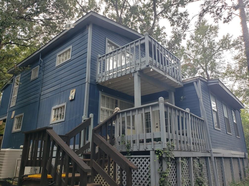 a front view of a house with a small yard