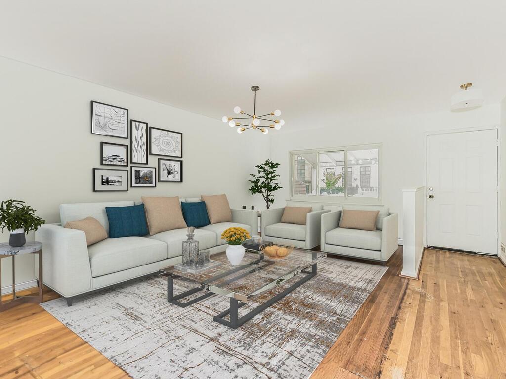 Living room featuring light hardwood / wood-style flooring and a chandelier