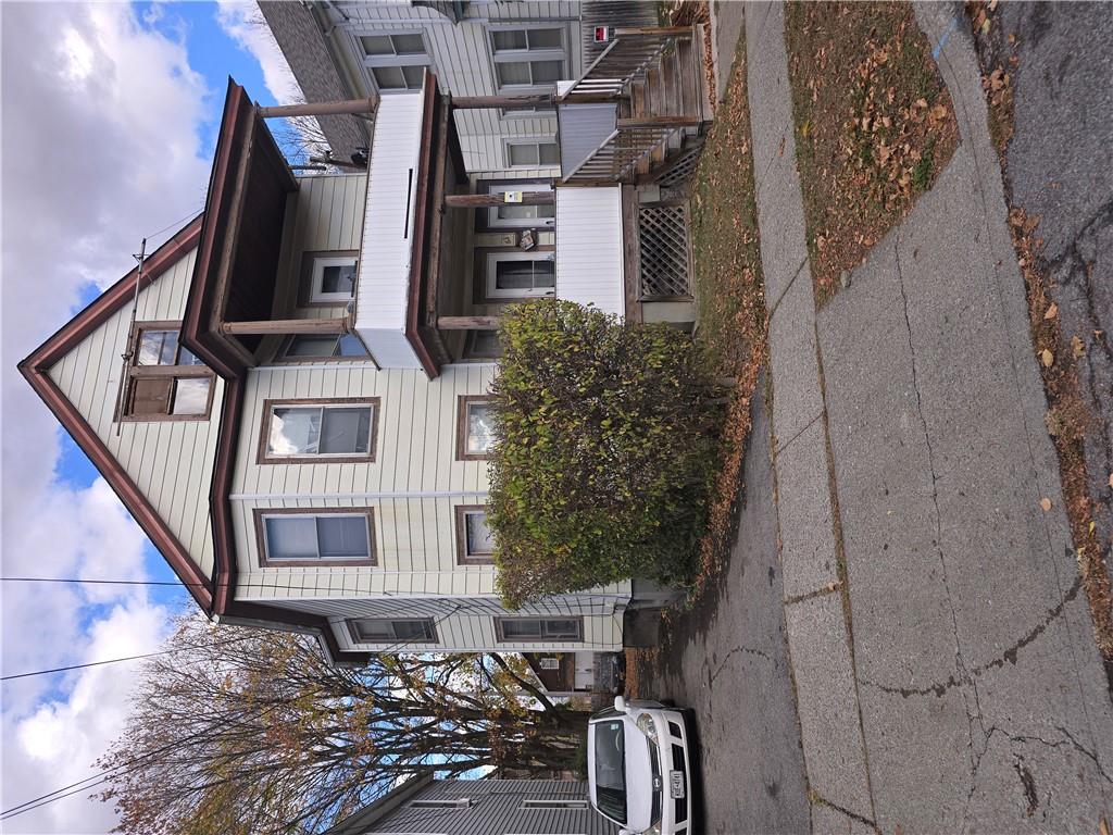 a front view of a house with parking