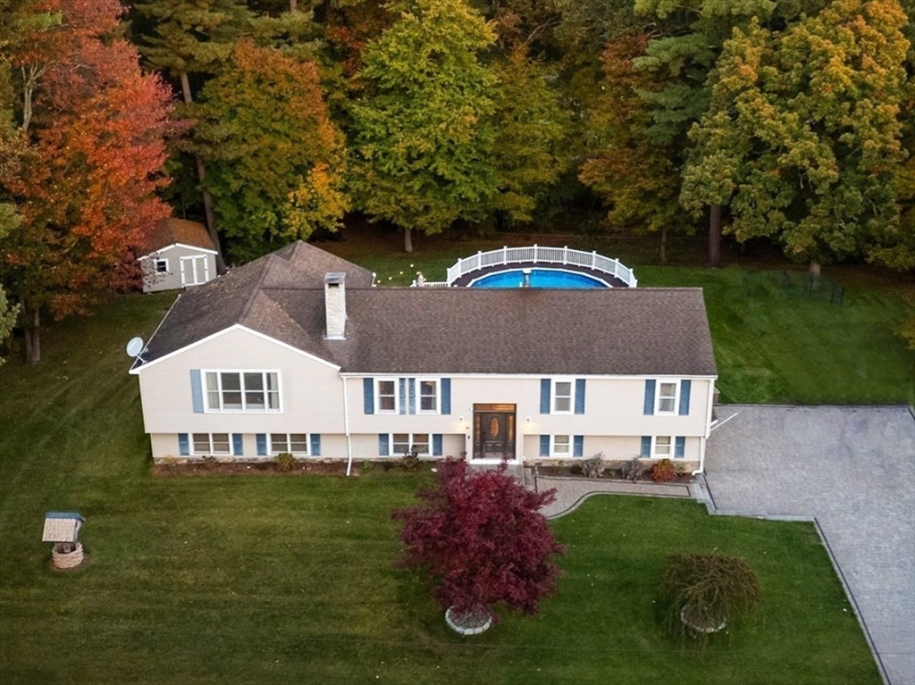 a aerial view of a house with garden