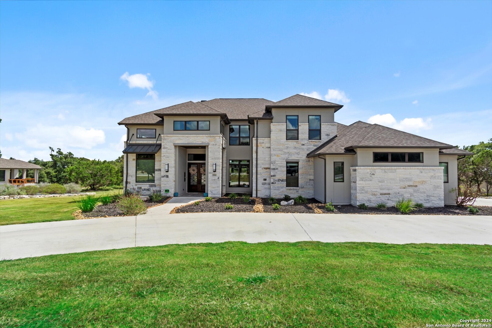 a front view of a house with a yard